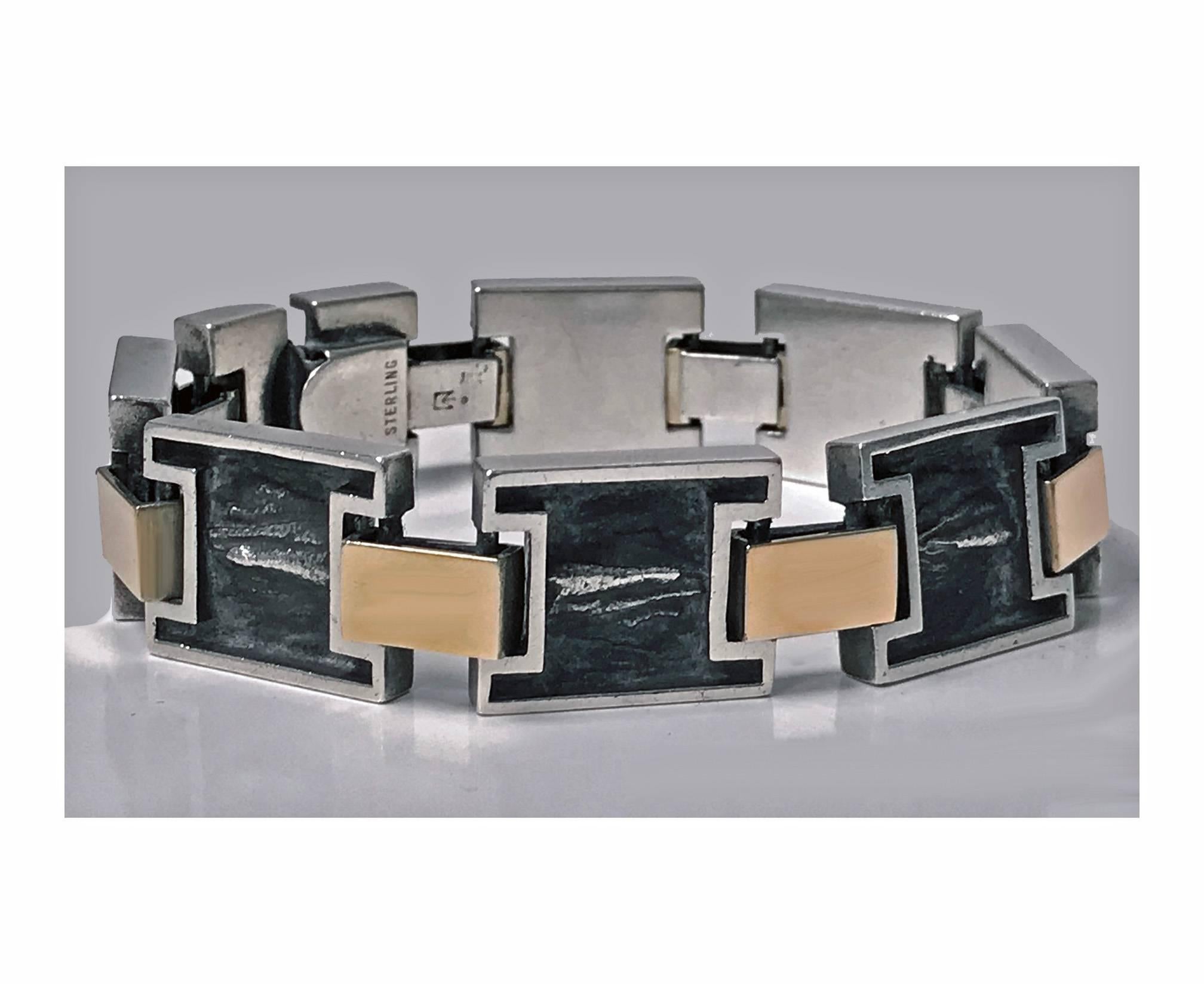 1960’s Modernist 18K and Sterling reversible handmade Bracelet. The Bracelet with eight incuse sterling rectangular links oxidised organic brushed finish with high polished surround mounts, 18K yellow gold rectangular links between, terminating with