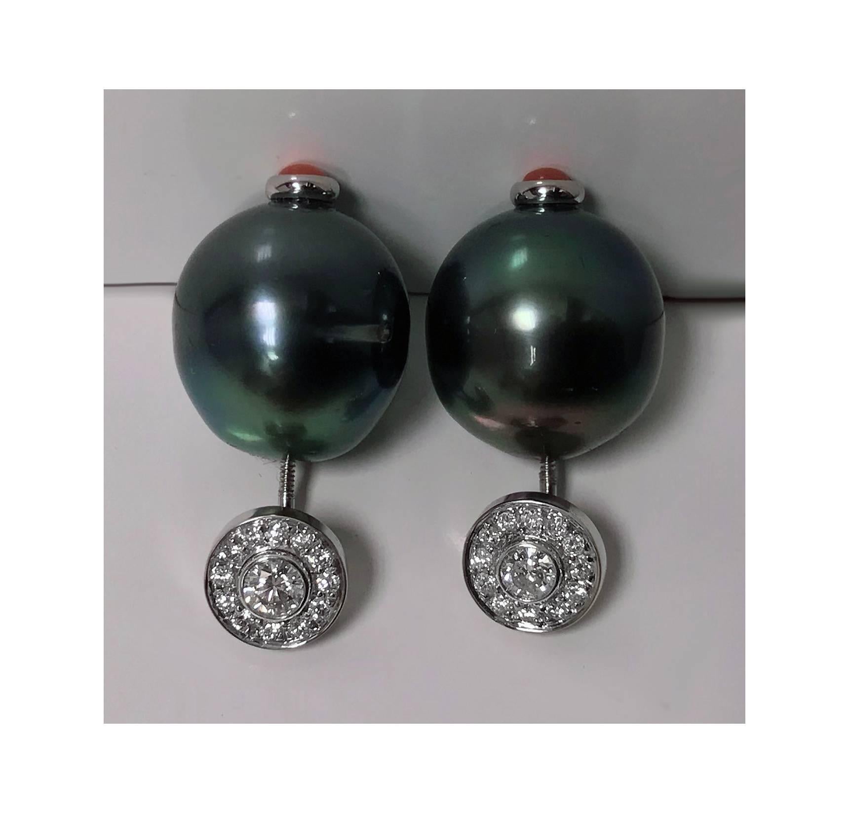 Pair 18K white gold Diamond, Black Tahitian Pearl Earrings. Each Earring with ovoid black Tahitian cultured pearl gauging approximately 15.5 mm, blemished, good lustre, green peacock overtones, the top with round brilliant cut detachable diamond