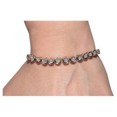 Bracelet tennis ancien datant des années 1900, en or 18 carats, argent et diamants naturels taille ancienne