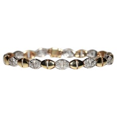 Bracciale decorato con diamanti naturali in oro 18 carati, vintage, anni '70, circa.