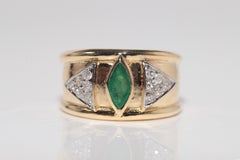 Anillo vintage circa años 80 de oro de 18k con diamante natural y esmeralda talla marquesa