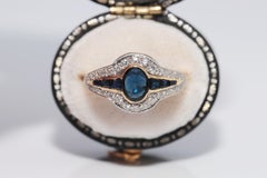 Anillo vintage circa años 80 de oro de 18k con diamante natural y zafiro
