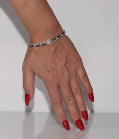 Bracelet vintage datant des années 1970, en or 18 carats, avec diamants naturels, saphirs et perles