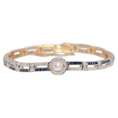 Bracelet vintage datant des années 1970, en or 18 carats, avec diamants naturels, saphirs et perles