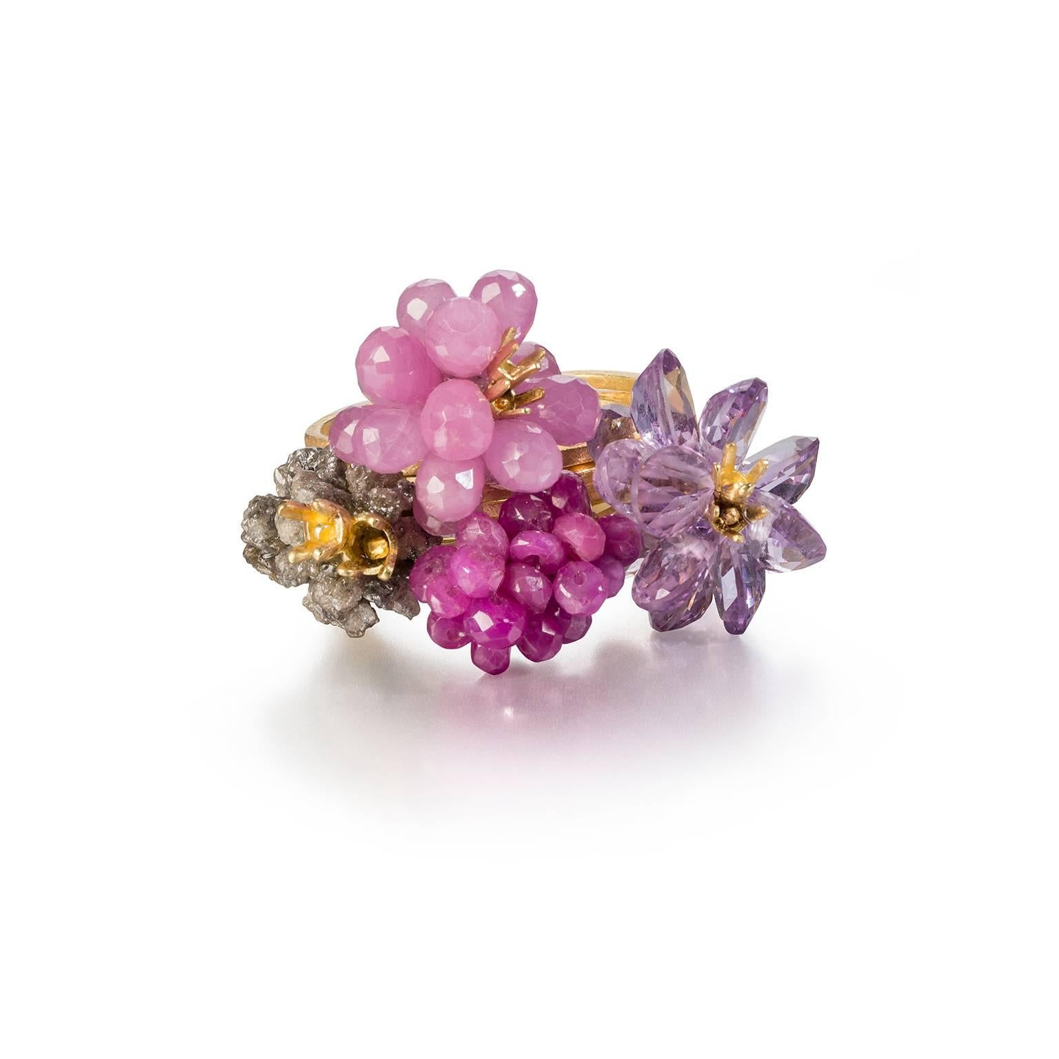 Exquisite Donna Brennan matte 18kt Gold Cocktail Ring featuring a clustered  array of Rough Diamonds, Ruby, Pink Tormaline & Lilac Amethyst stones. 7 shank rink in a size 8 (size Q). Hallmarked by Goldsmiths' Hall, London.

Donna's work typically