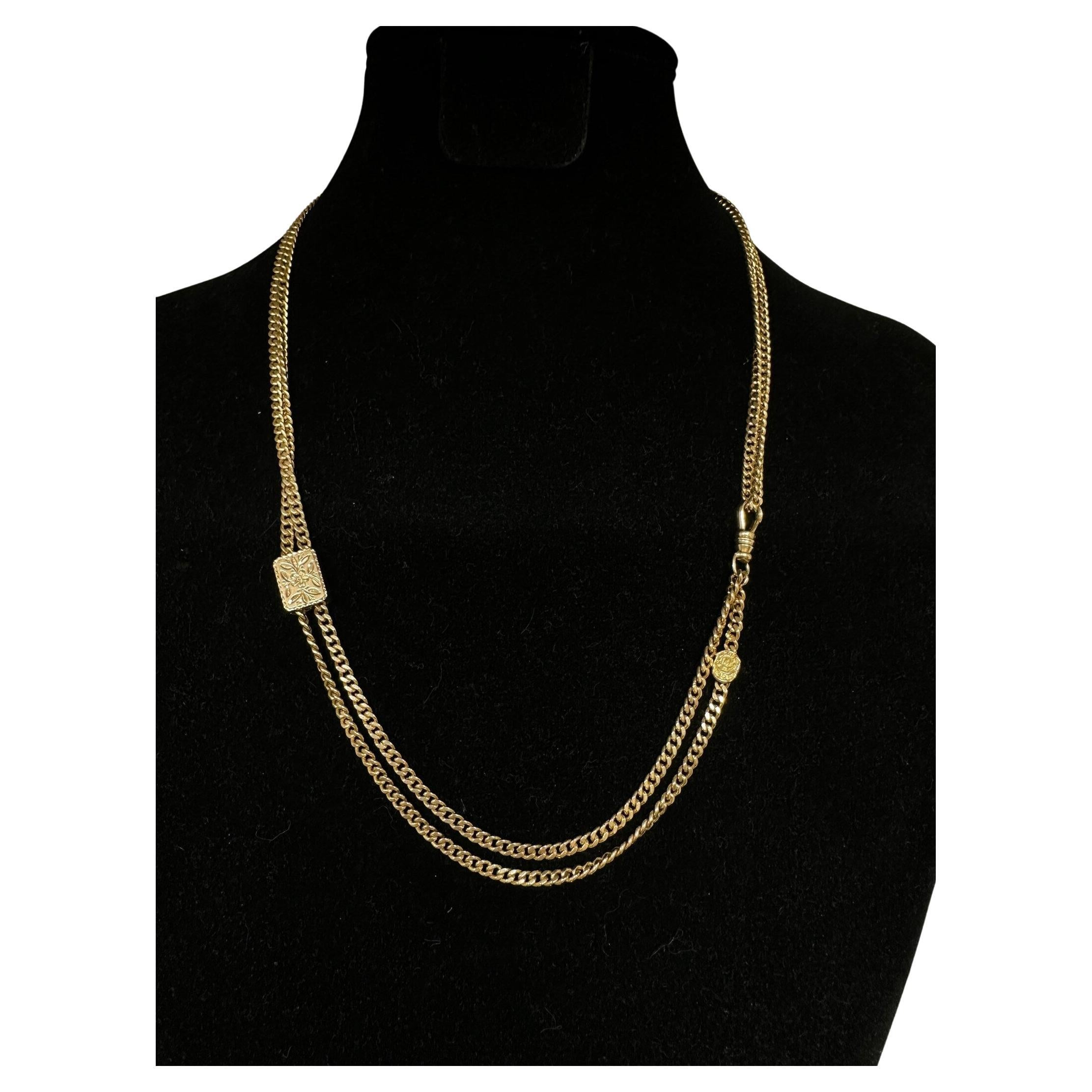 This stunning antique 14k yellow gold curb link long chain with slider is a chain lovers delight. Move the engraved slide up and down to create different styles and lengths of the necklace. A favorite charm, pendant or watch may be added on the dog