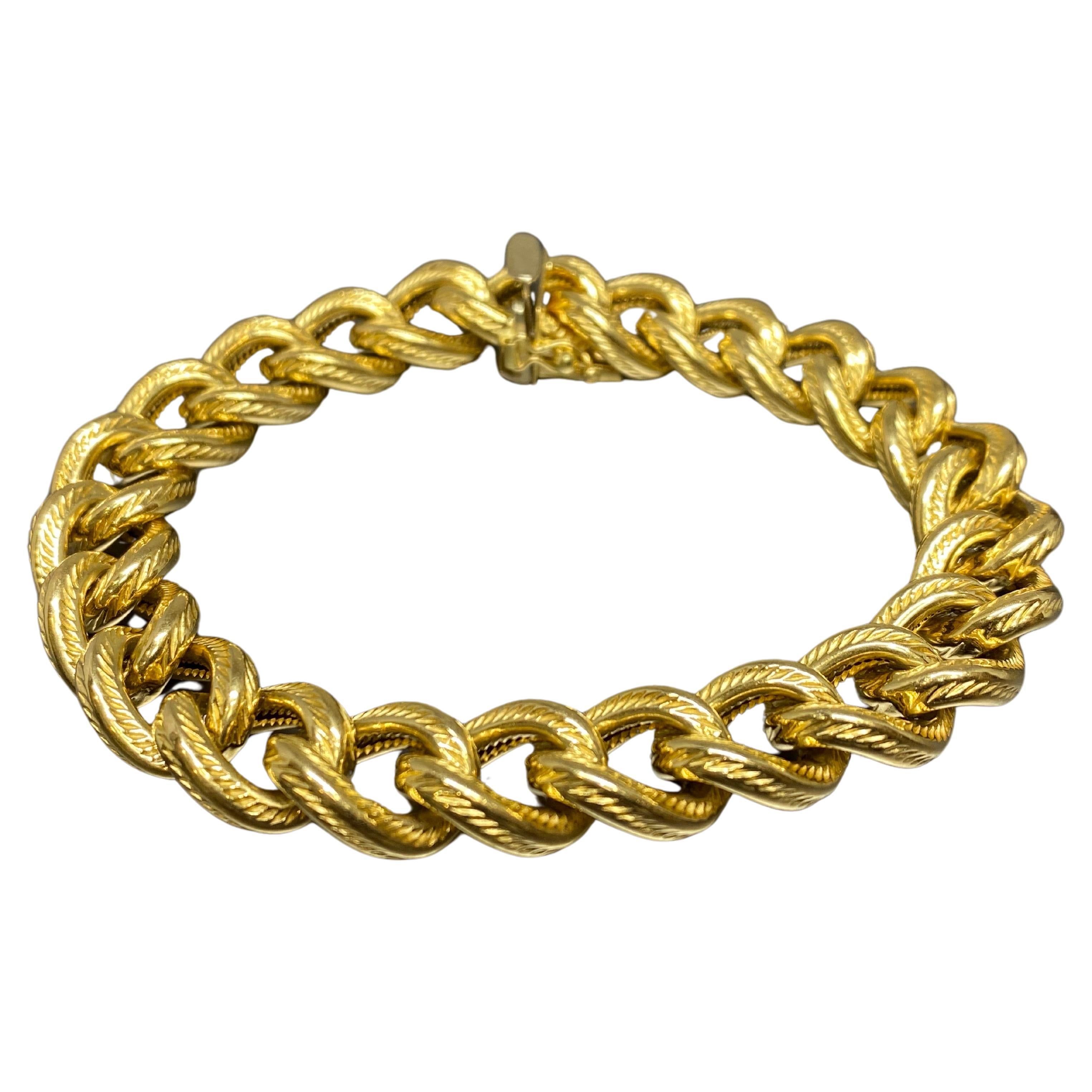 Gorgeous circa 1960's, 70's vintage 18k yellow gold textured curb link bracelet. Never underestimate the value of a good curb link bracelet. They add a dash of sexy, stylish elegance to just about anything you wear. This lustrous beauty has a 