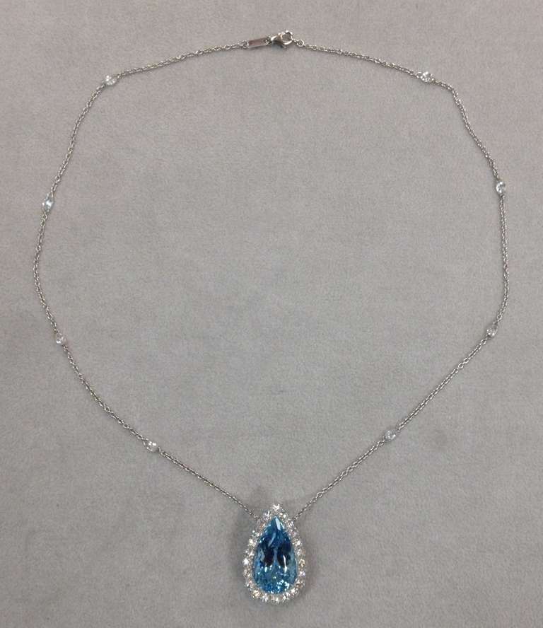 A vivid blue 14.58ct pear-shape Aquamarine is hand set in a 3.65ct total rose-cut diamond and diamond briolette necklace. 

The collection quality rose-cut diamonds are surrounding the Aquamarine and the fine diamond briolettes are adorning the
