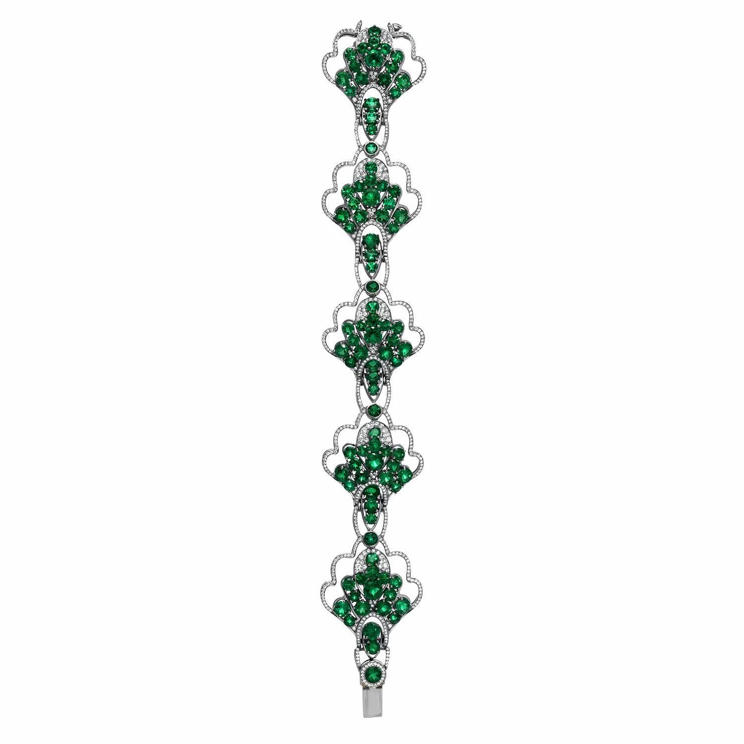 Collection quality round Colombian Emeralds weighing a total of 18.90 carats, adorned by a total of 2.28 carat E-F/VVS round brilliant diamonds, comprise this exceptional platinum bracelet.
Crafted by extremely skilled hands in the USA.
Length: 7