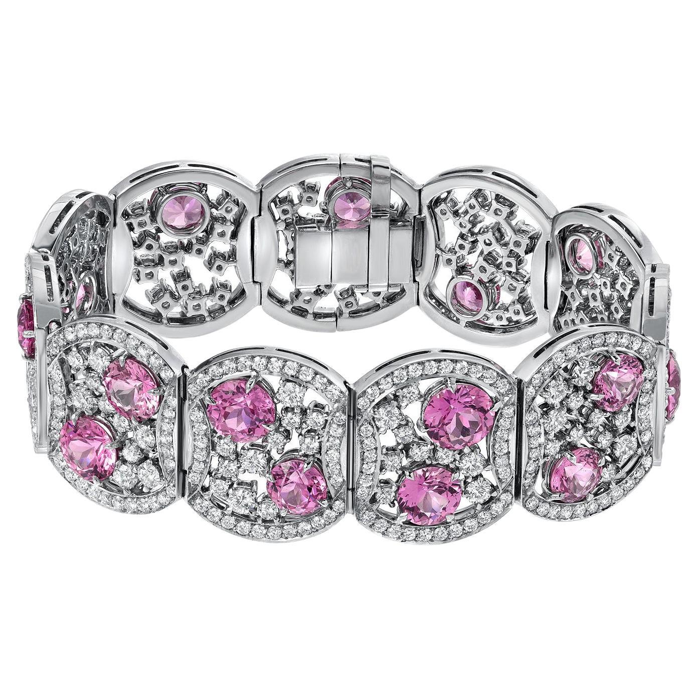 Extraordinary one of a kind platinum diamond bracelet, set with 15 ultra fine round Pink Sapphires, weighing a total of 19.54 carats, and round brilliant diamonds weighing a total of 10.99 carats.
Total length: 7 inches.
Total width: 1.75