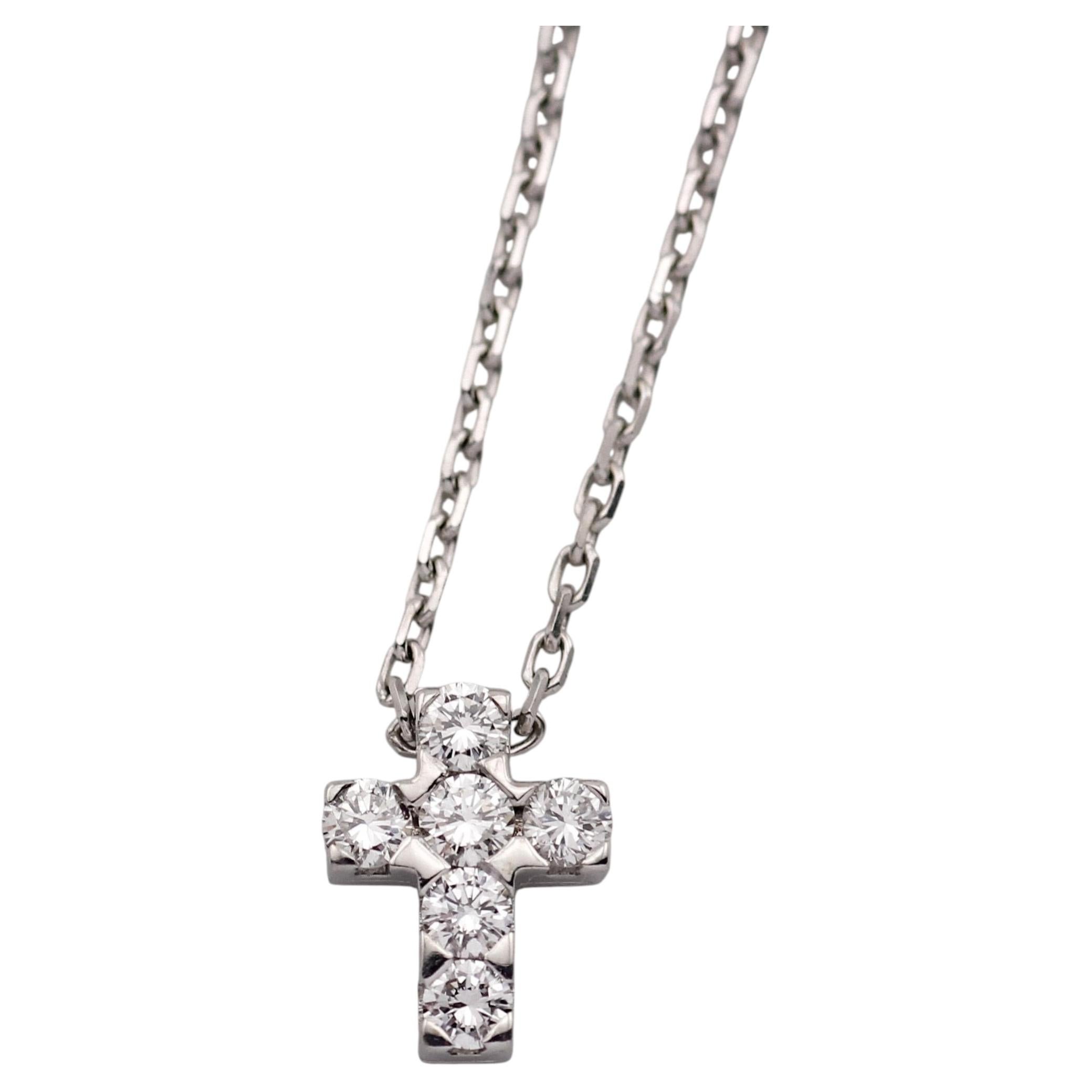 Van Cleef & Arpels, collier pendentif croix en or blanc 18 carats et diamants