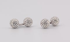 Boutons de manchette Hermès vintage en argent massif en forme de balle de golf, vers les années 1970