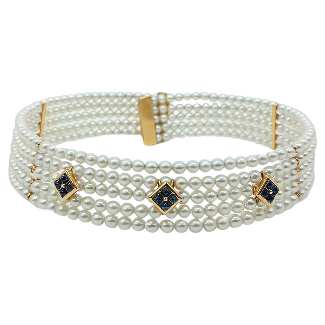 Rigid yellow gold choker with pearls