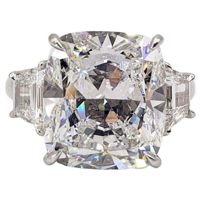 Rosenberg Diamonds & Co. 10.12 carat Cushion Cut H color SI1 clarity is accompanied by a GIA certificate. This spectacular Cushion is full of brilliance and it is set in a handmade platinum setting with perfectly matched pair of step cut traps