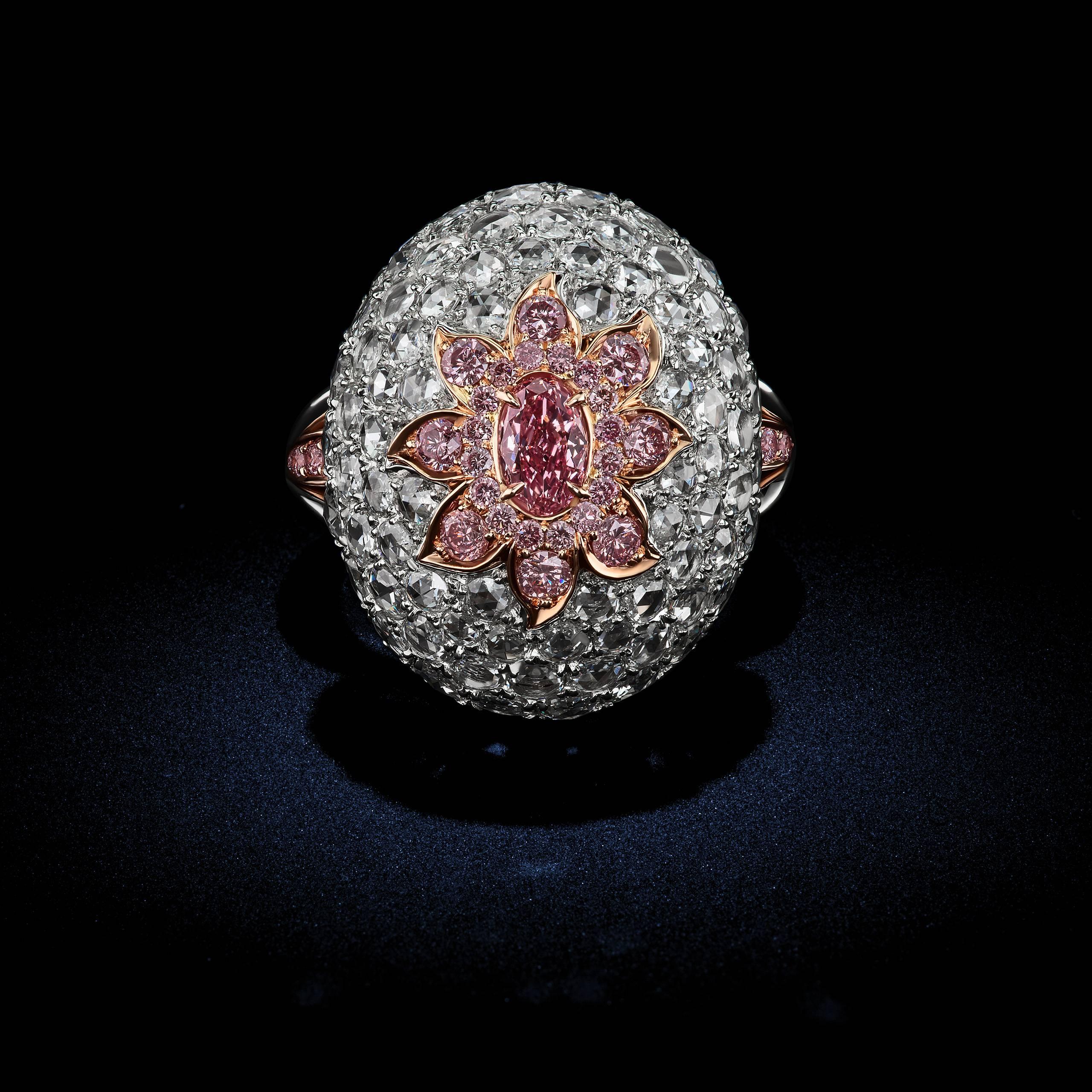 Countless Pavé set white Diamonds support this exotic beauty abloom with scintillating petals of pink Diamonds and a GIA Certified Fancy Intense Argyle Pink Diamond. This romantic center-stone emanates a rich warm pink color with deeper tones of