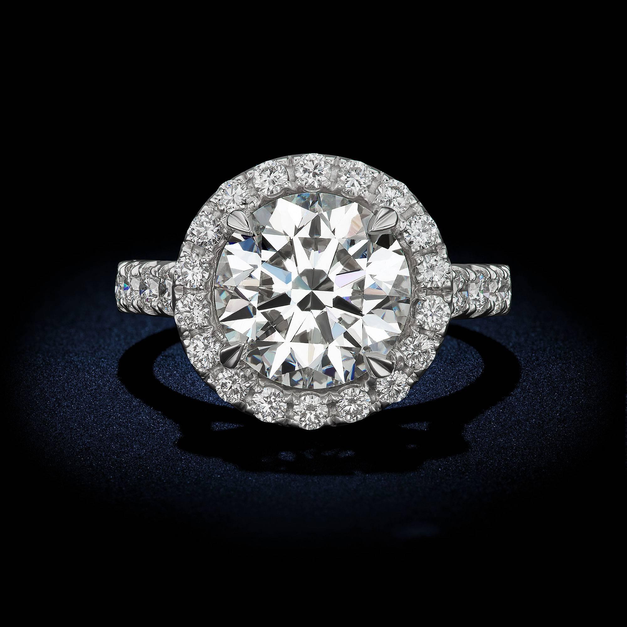 Round Brilliant Diamond Ring
A Stunning 4 Carat Round Brilliant Diamond creates a classic look in this timeless design. Having a color and clarity of H/SI1 accompanied with a GIA Certificate. Completing this look with perfectly matched display of