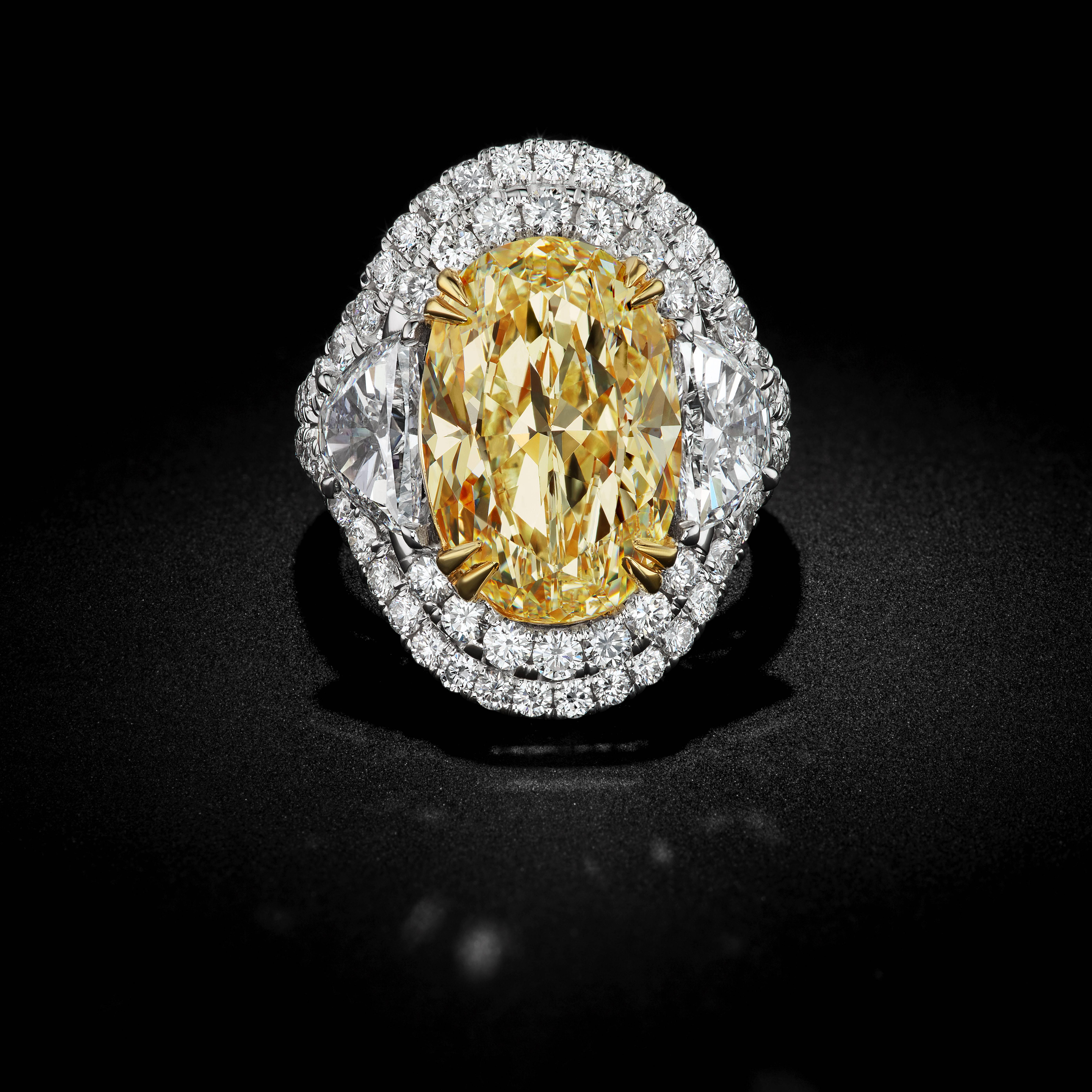 Brand new extraordinary 8.88ct oval diamond is the ultimate beauty. This unique fancy light to fancy yellow diamond has a clarity of SI1. Surrounding this stone is brilliant half moons with a total weight of 1.67

David Rosenberg is President of