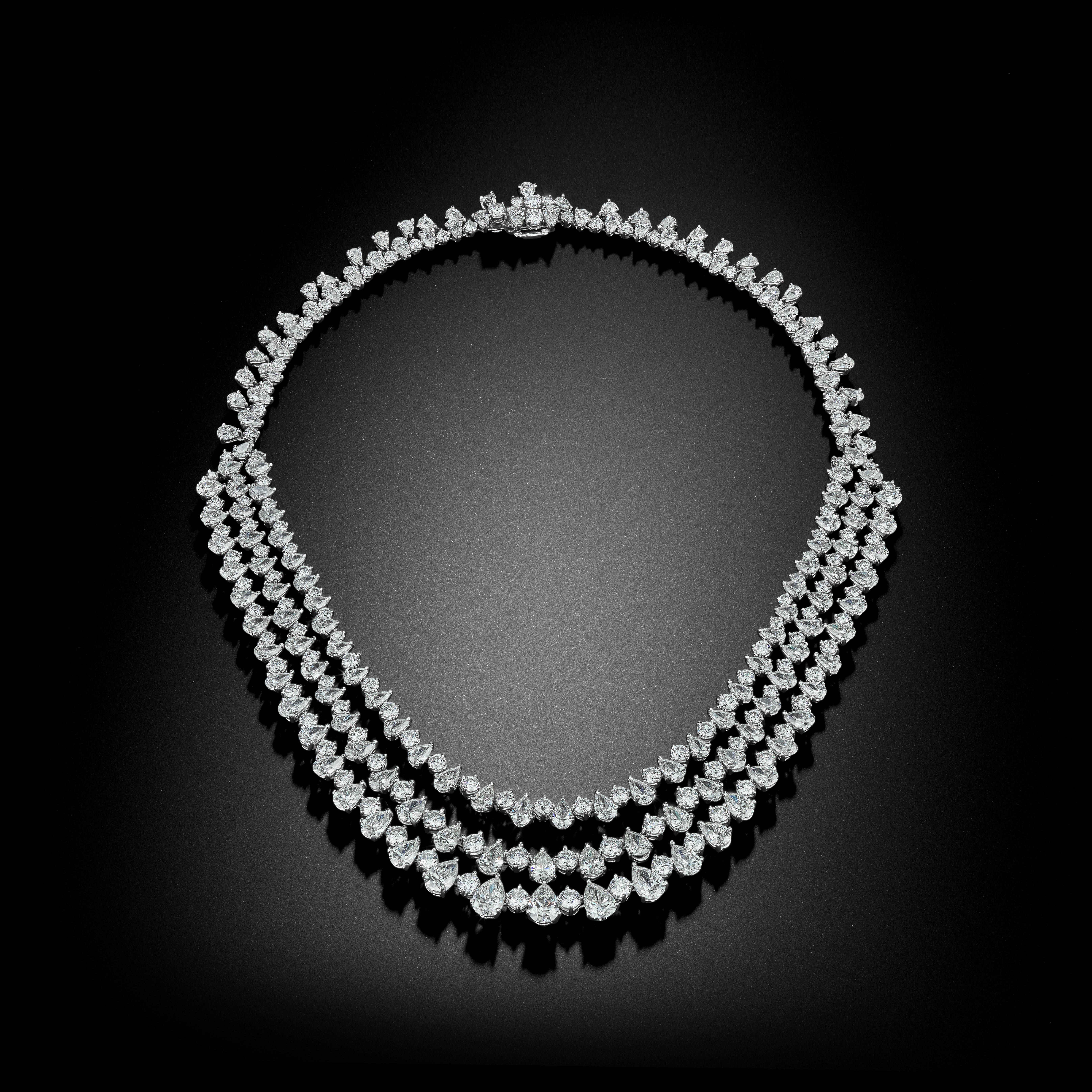 A stunning masterpiece to complete any collection. This captivating necklace features over 80 Carats of some of David Rosenberg's most exceptional Diamonds. Crowned in Platinum, bands of alternating Teardrop Pear Shape and Round Brilliant Diamonds