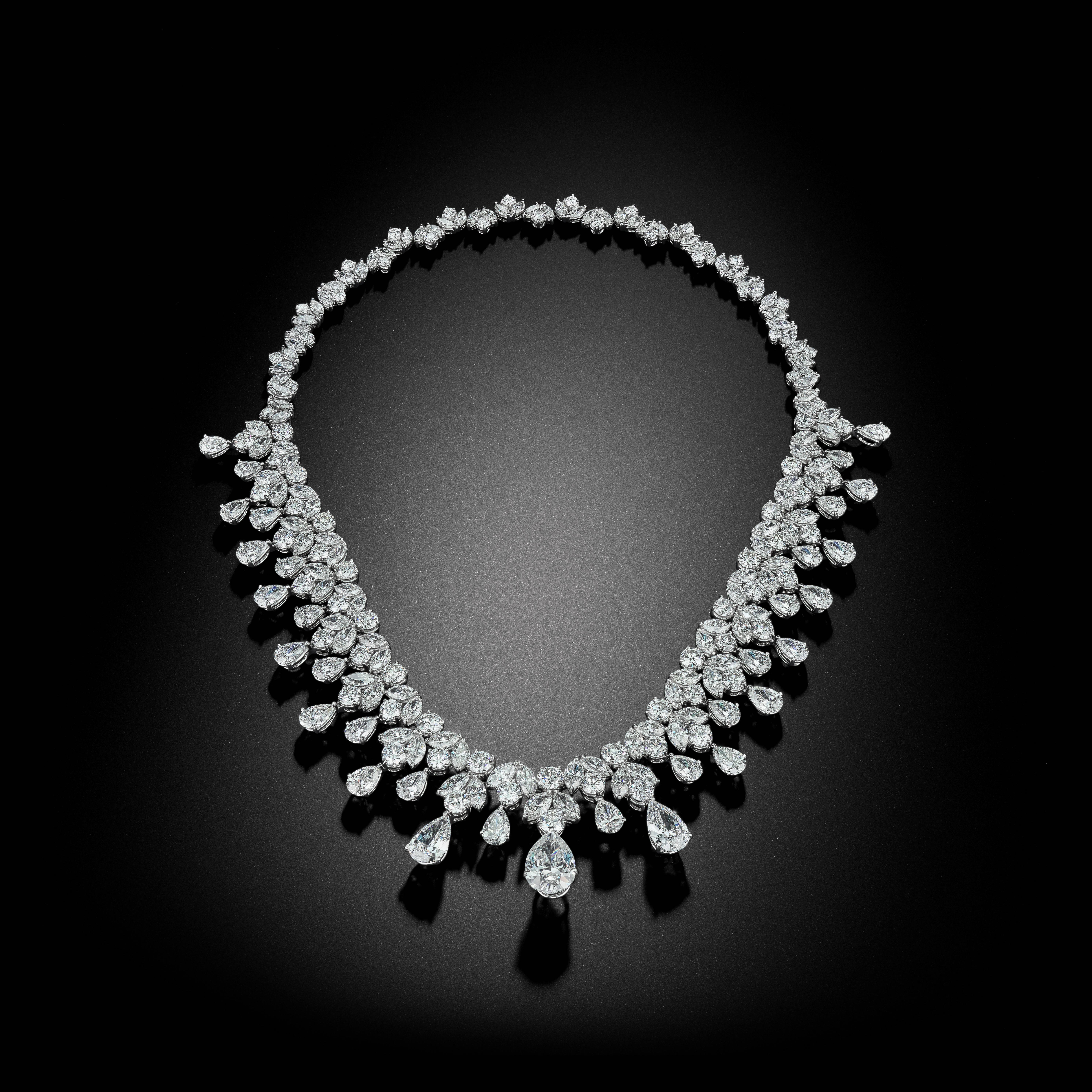 This handmade Platinum Necklace has over 96 Carats of Pear Shape and Brilliant Cut Diamonds. It has the versatility to be worn as either a Necklace or a dazzling Tiara.  Its craftsmanship is beautiful and extremely unique. It will turn anyone who