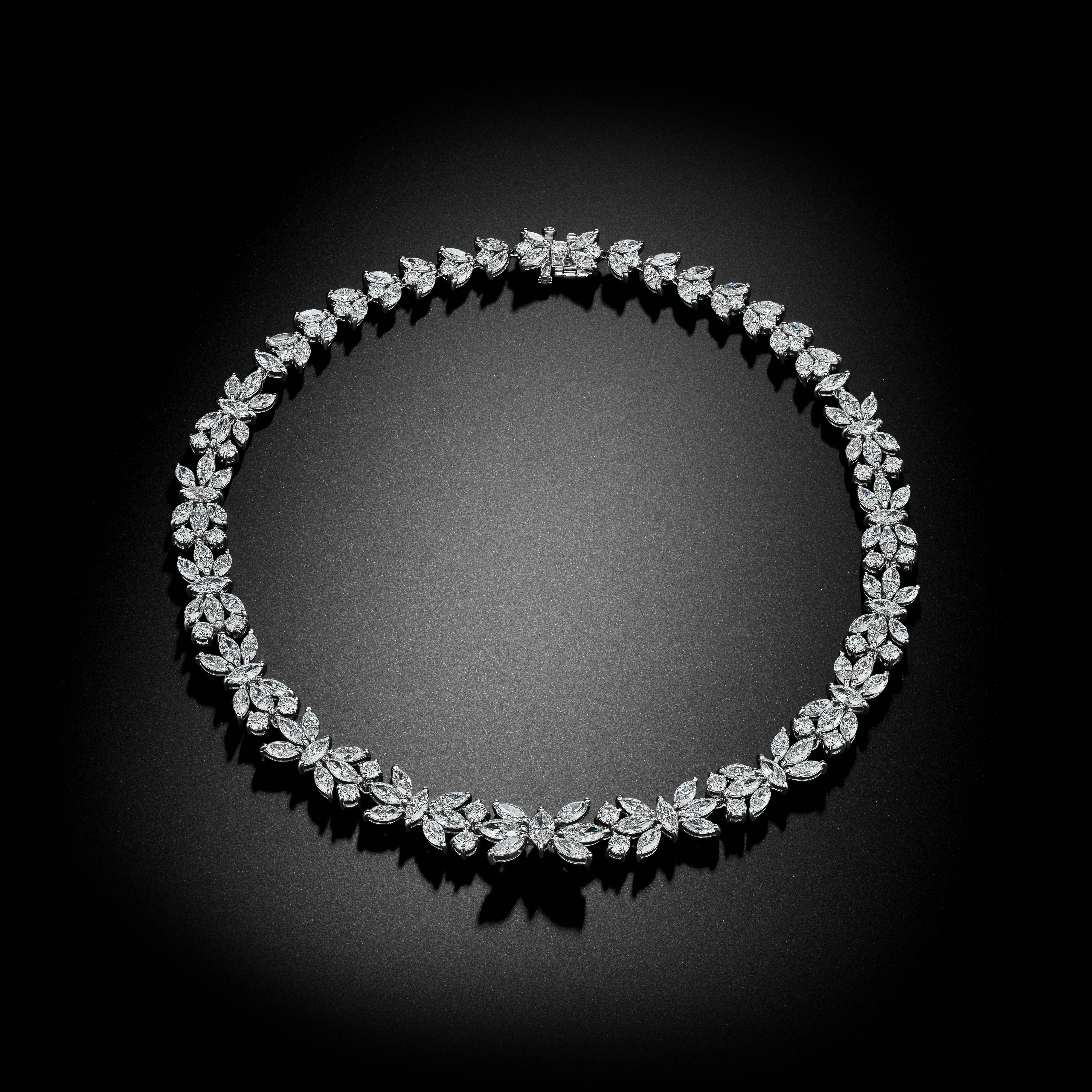 This handmade Platinum Necklace is set with Brilliant and Marquise Shape Diamonds and has an approximate total weight of 49.75ct tw. A unique and timeless piece!

David Rosenberg is President of the Diamond Bourse of the Southeastern United States