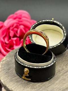 Bague vintage en or 18 carats, sertie en canal de rubis et de diamants, demi-éternité