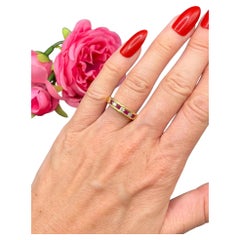 Bague vintage en or 18 carats, sertie en canal de rubis et de diamants, demi-éternité