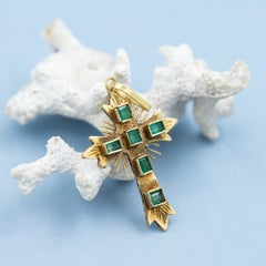 Vintage 18 karat solid gold cross pendant with green natural emeralds