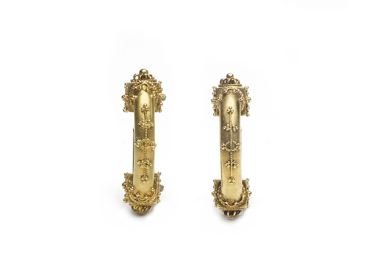 A pair of Victoria Etruscan style hoop earrings, set in gold with wire fitting, circa 1870.
Inside diameter measures 16 x 10mm.