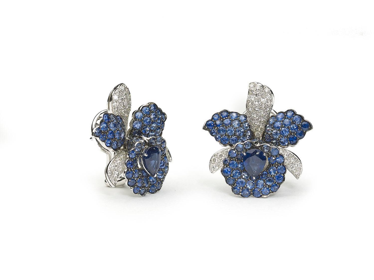 Sapphire and diamond orchid earrings, set with a pear cut sapphire to the centre weighing an estimated 1.30ct each, with sapphire and diamond set petals, estimated total additional sapphire weight 8.85ct, estimated total diamond weight 1.60ct,