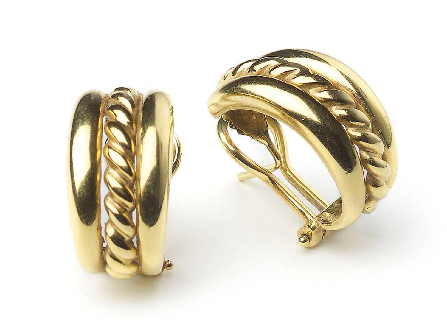A pair of 18ct gold half hoop earrings, designed as three sections the centre a gold rope effect with plain gold sides, clip and post fittings. 