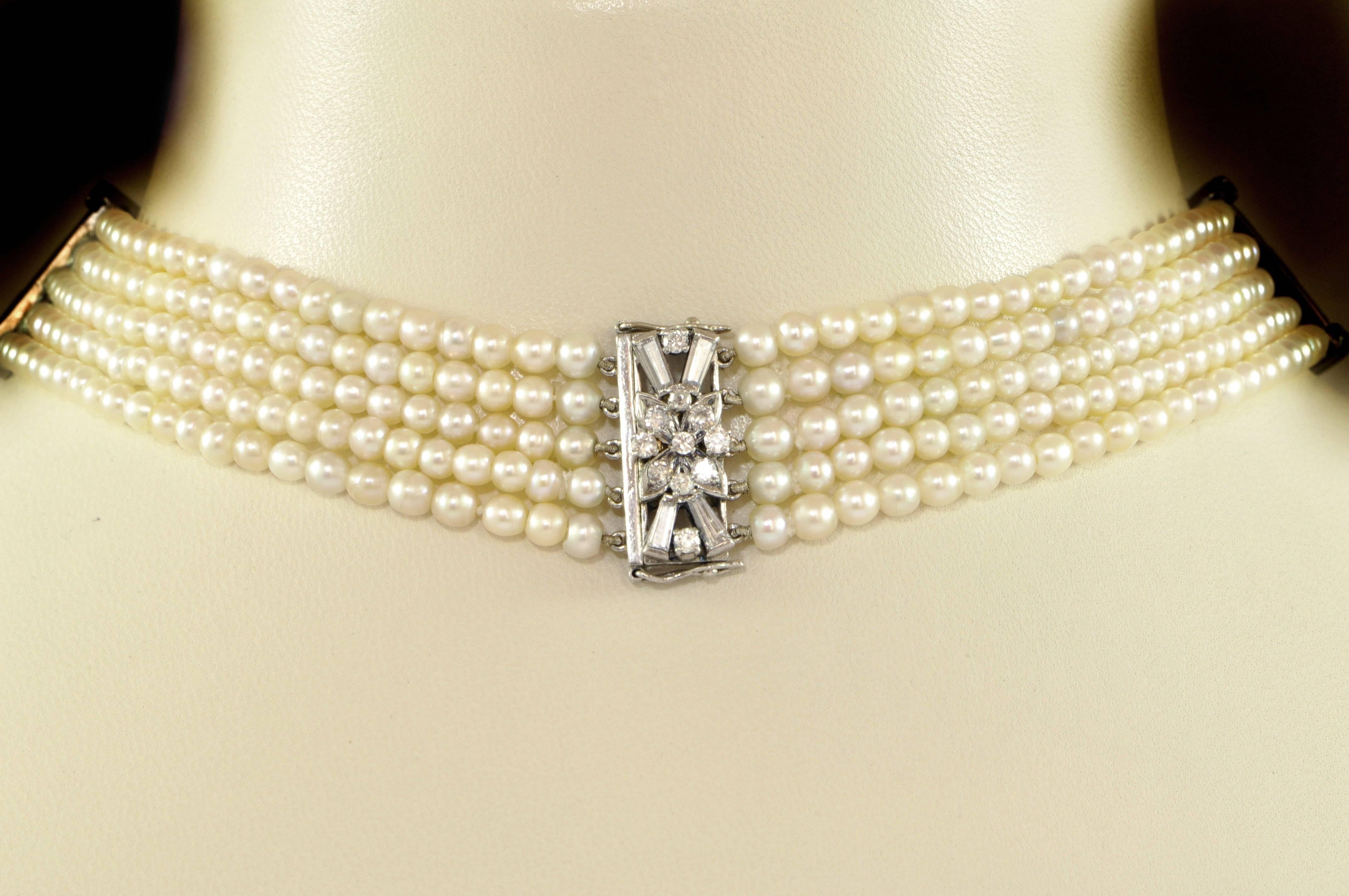 A five row pearl choker, with three diamond set spacer bars, set with three, channel set, baguette-cut diamonds and a claw set round brilliant-cut diamond at each end. With a diamond set clasp, with baguette and round brilliant-cut diamonds.