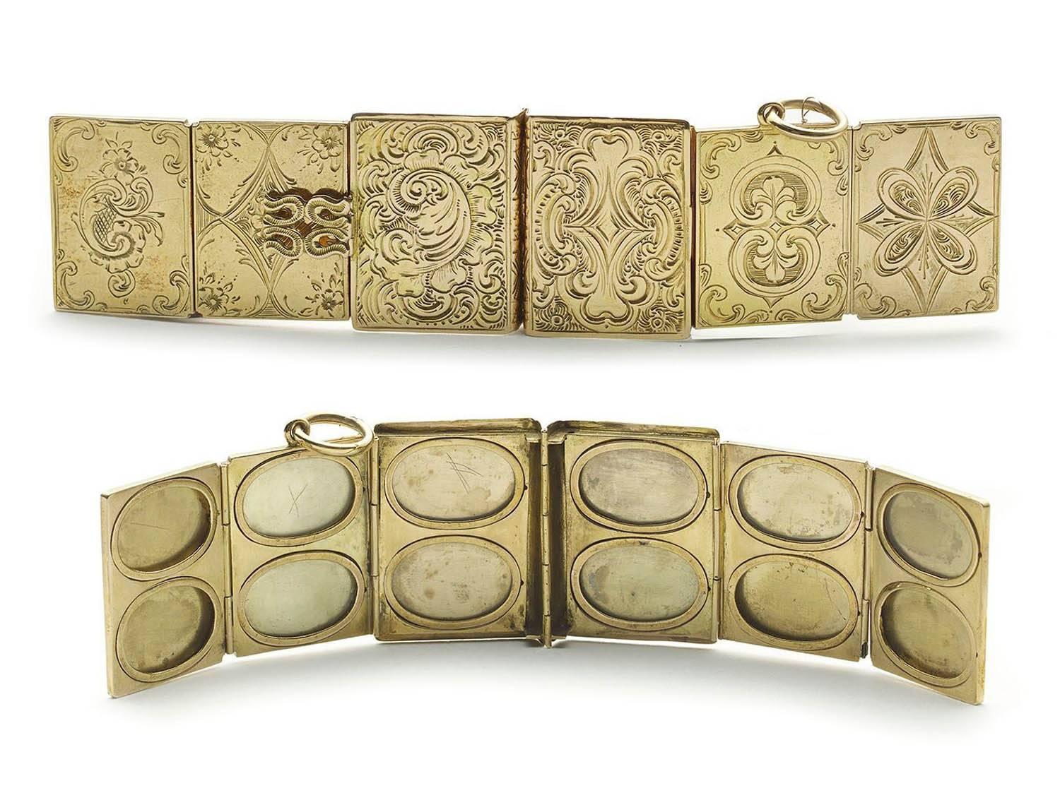 A photograph locket, in the form of a book, with six panels, each of which holds two photos, mounted in gold with engraving.