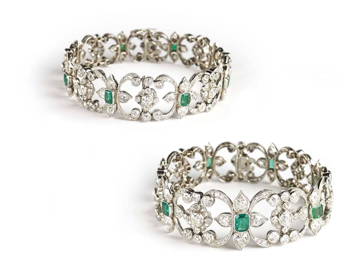 An Edwardian emerald and diamond choker/bracelet combination, of fine open work with a series of quatrefoils centring a square step-cut emerald to each and diamond set scrolls and cluster set with old-cut and rose-cut diamonds in a millegrain