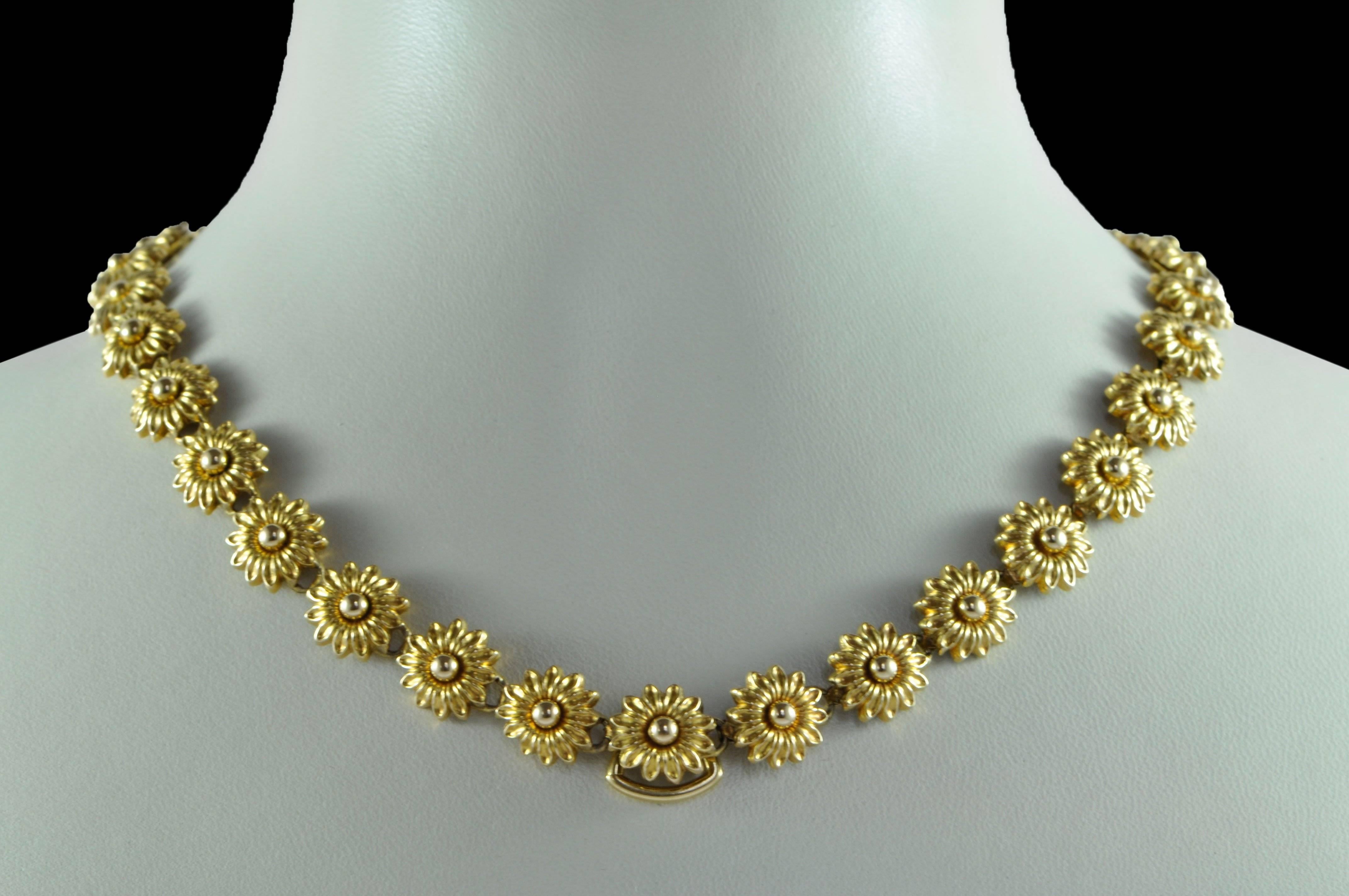 Antique gold daisy flower necklace, with stamped flower links.