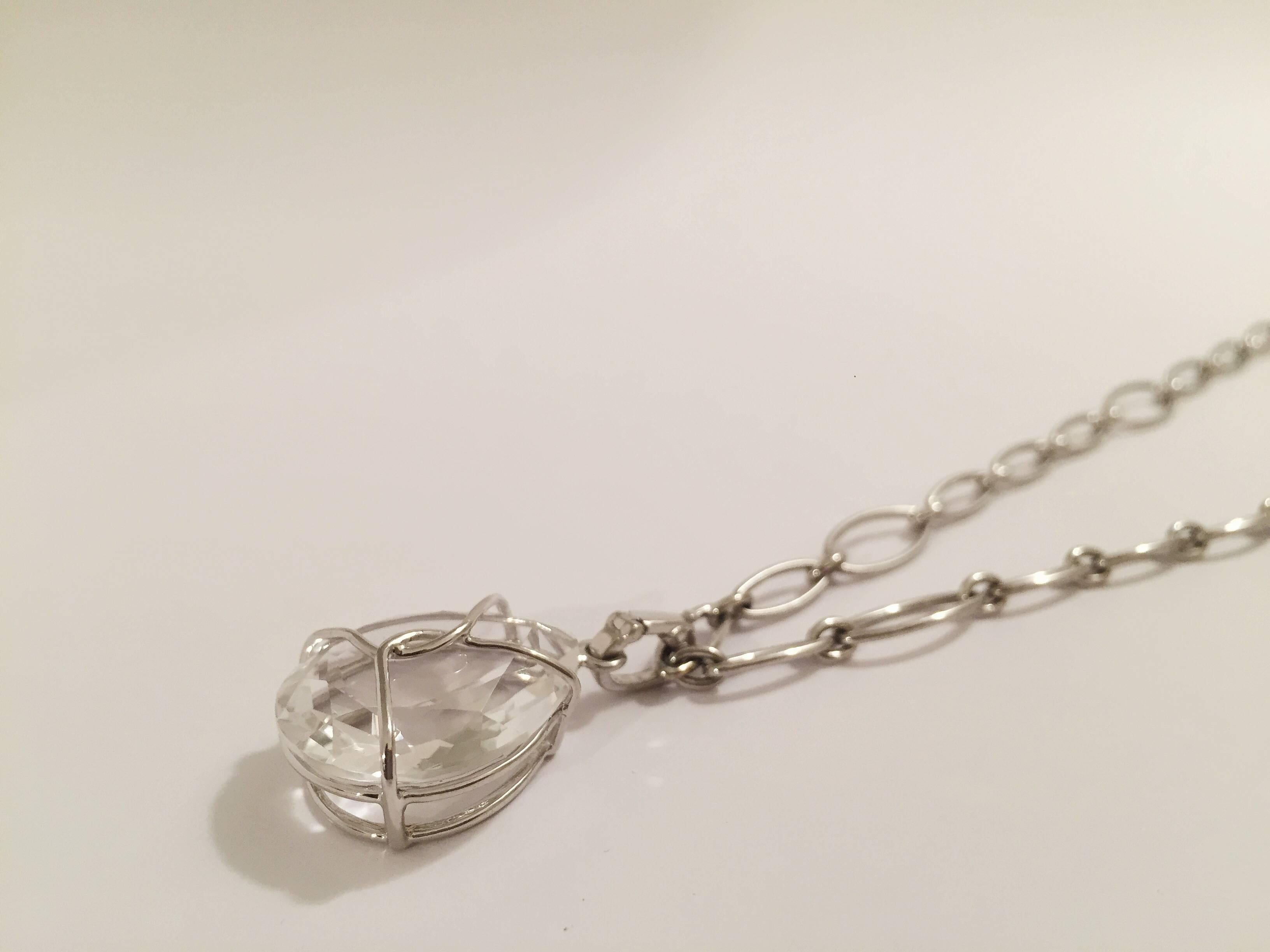 18kt White Gold Marquise Link Choker Necklace With Rock Crystal Pendant. 

This elegant necklaces combines small marquise links with 6 larger marquise links.  The necklace measures 17 and 3/4 
