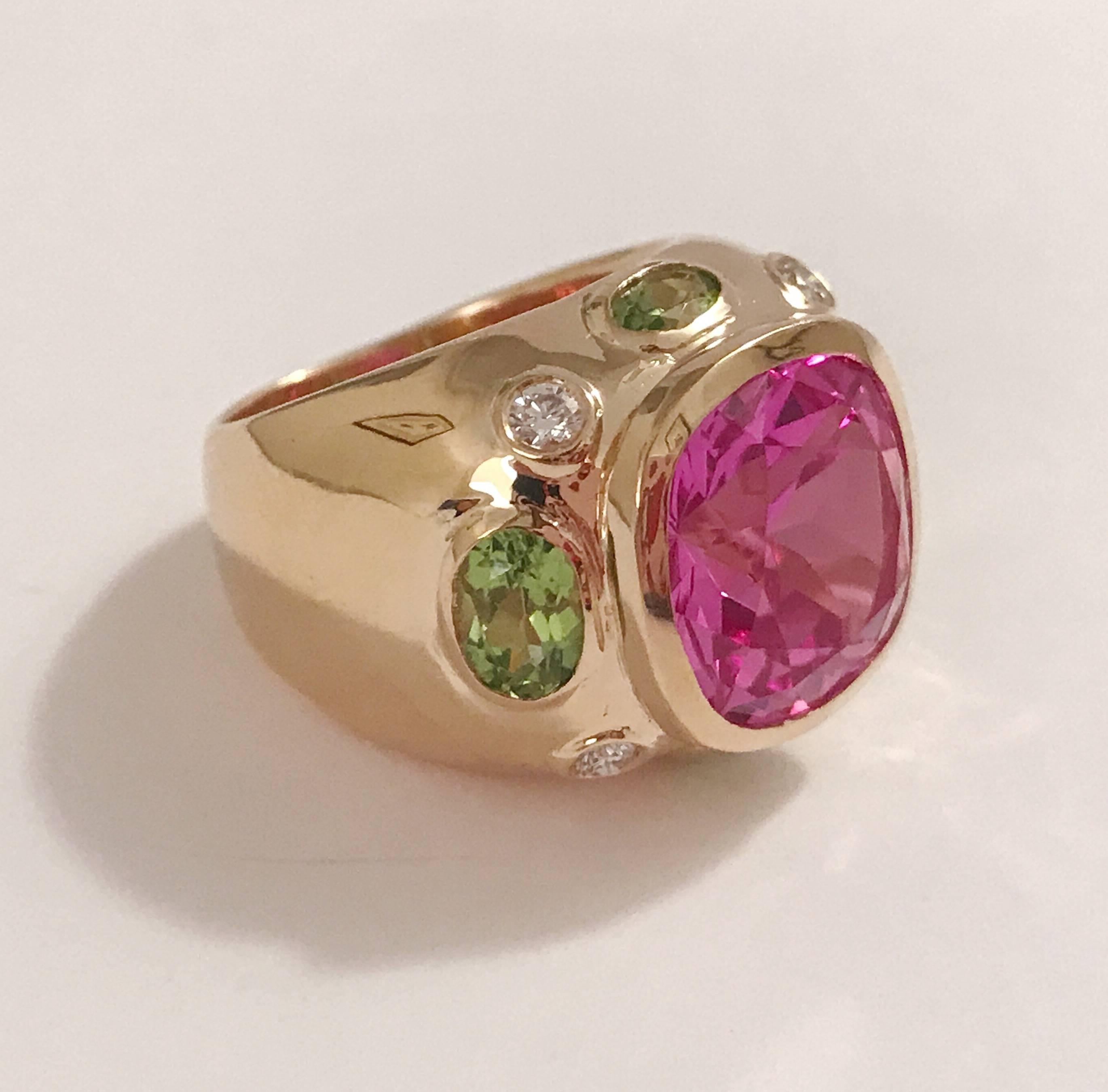 The BONHEUR Ring: 18kt Yellow Gold Domed Ring with faceted pink topaz cut center stone and faceted oval Peridots and round Diamonds. 

This ring is available in in any color stone combination.

This ring may be sized.

Please contact me with any
