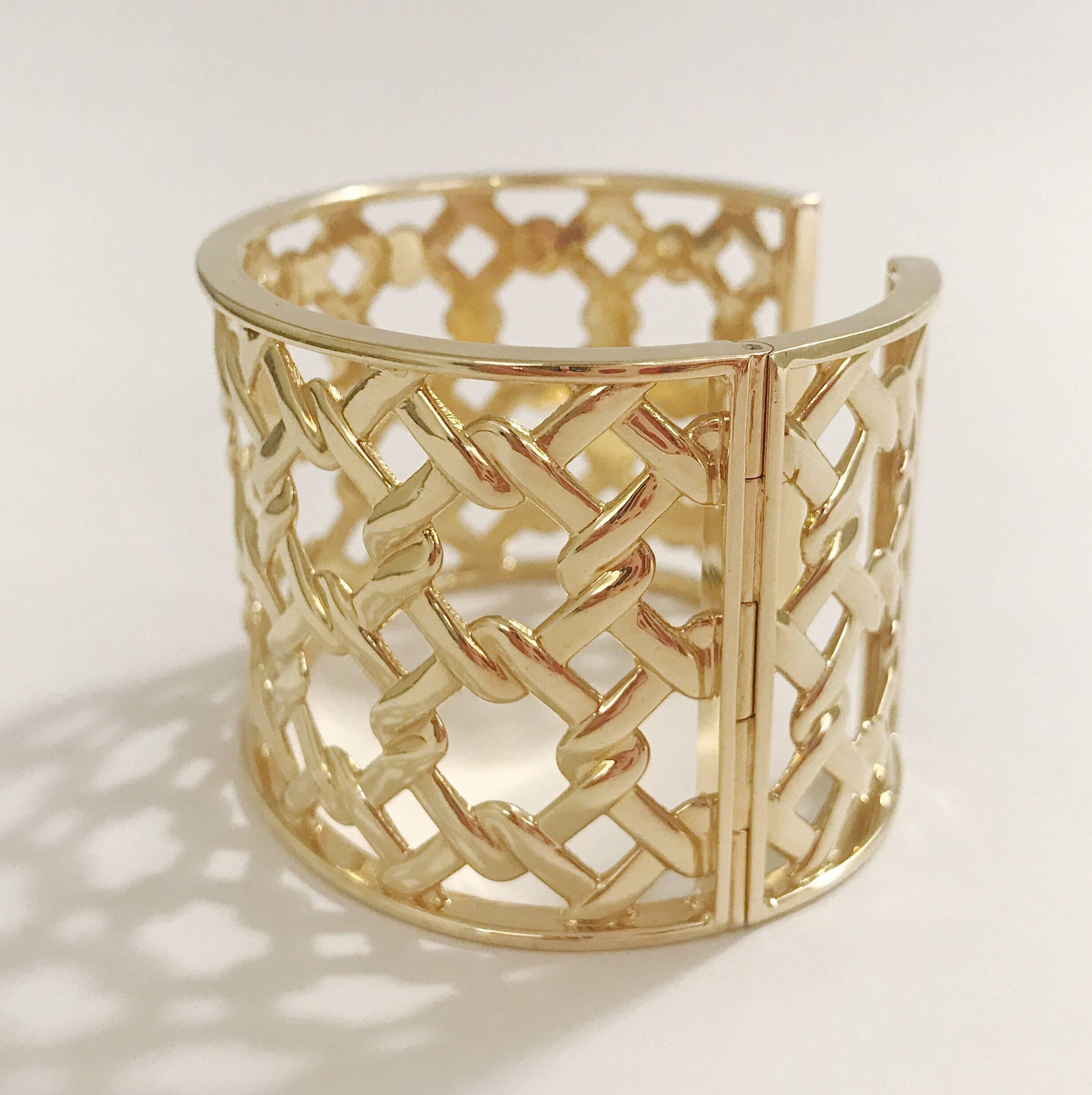 18kt Yellow Gold Basket Weave Cuff is made with an adjustable hinge to make it easier to take on and off. 

This cuff can be made in Rose, White, or Yellow Gold. In addition diamonds can be added for more detail. 

Please contact us with any