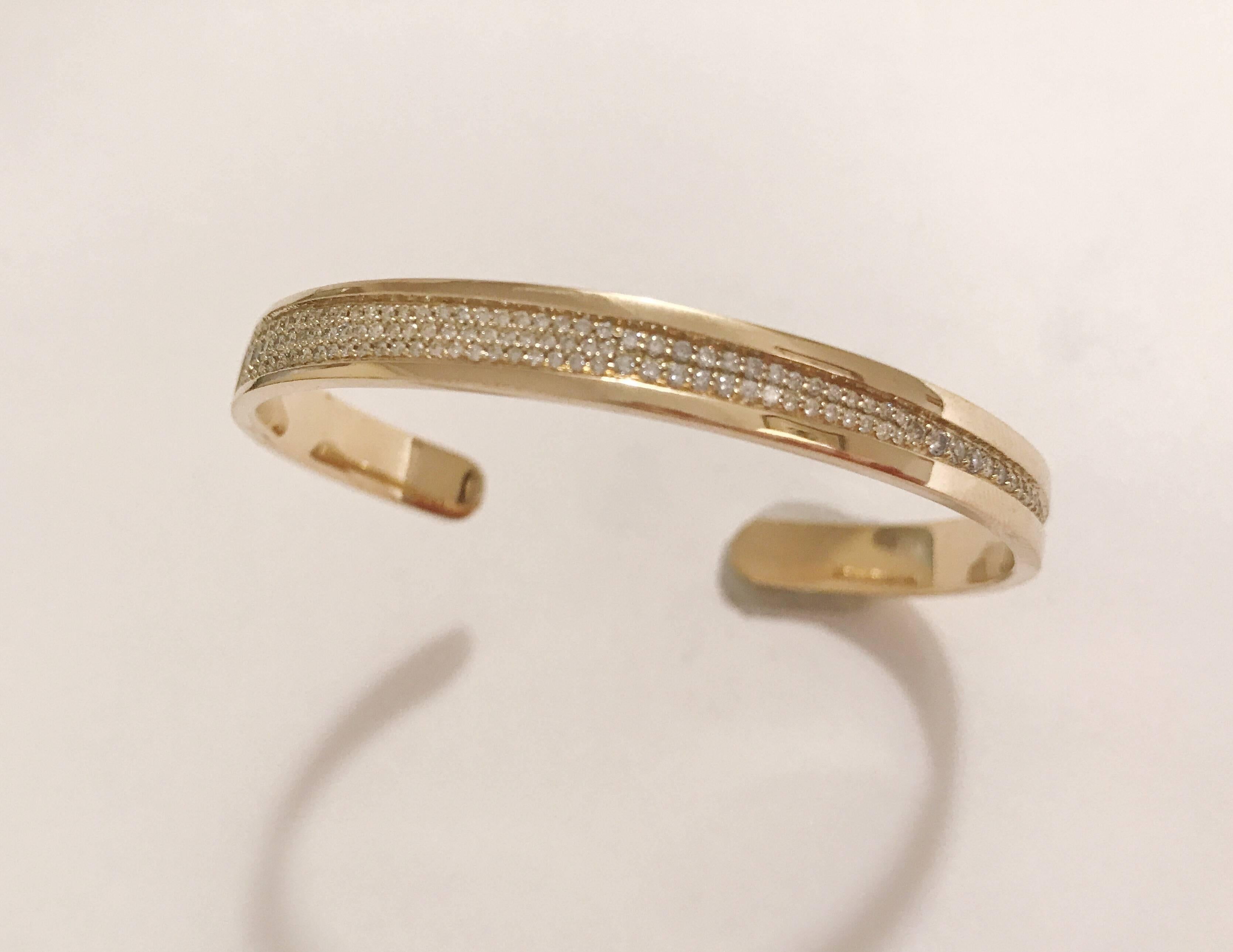 18kt Yellow Gold Granulated Diamond Cuff Bracelet is ~ approximately 1.00 cts. 

This cuff bracelet can be made in any color gold and fits to all wrist sizes. 

Please contact us with any inquiries you may have. 

Best, 
Christina Addison