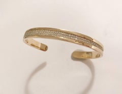 Bracelet manchette en or jaune et diamants granulés