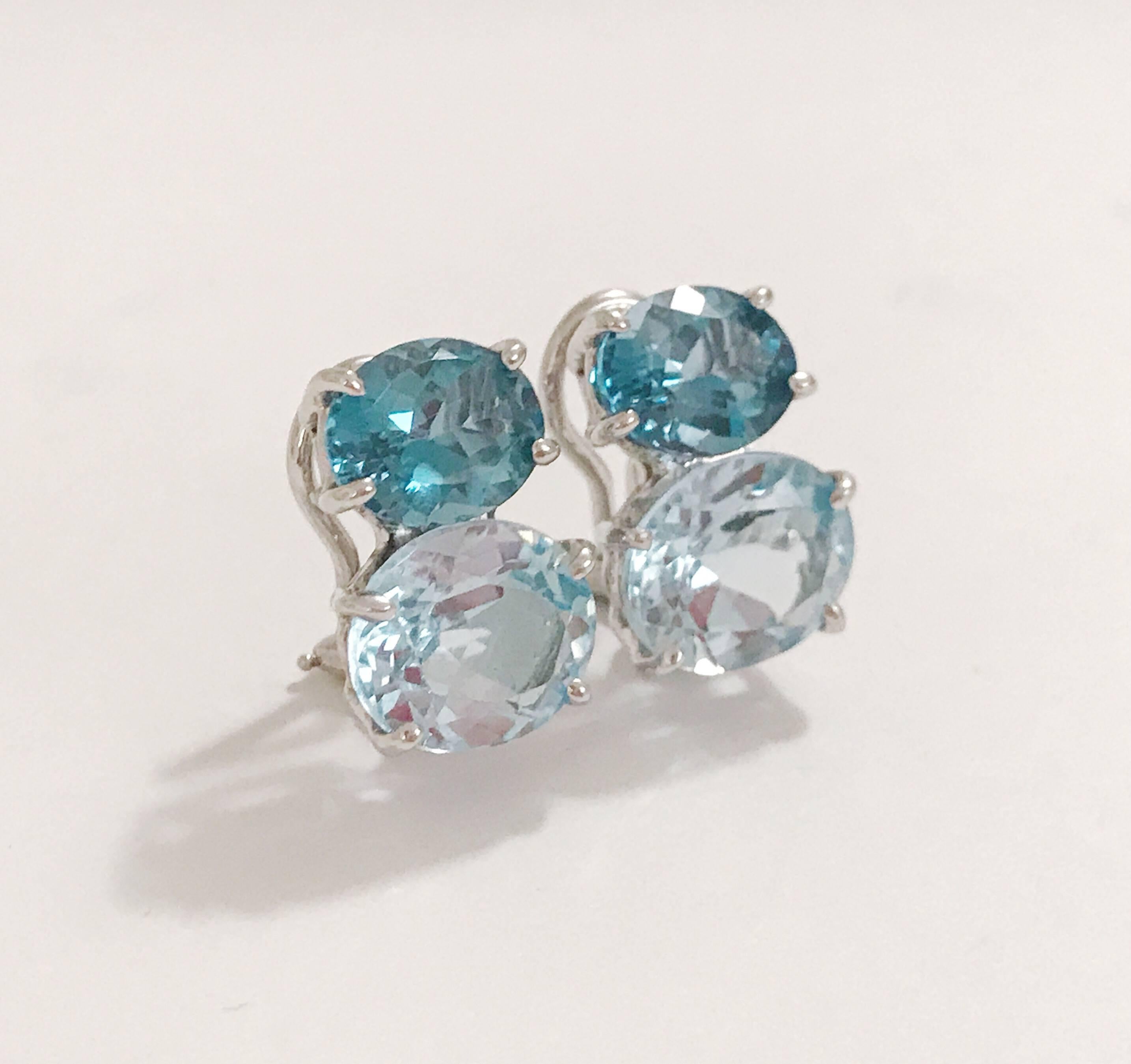 Medium 18kt yellow gold GUM DROP™ earrings with faceted Blue Topaz (approximately 2.5 cts each), Blue Topaz (approximately 5 cts each)

Specifications: Height: 3/4