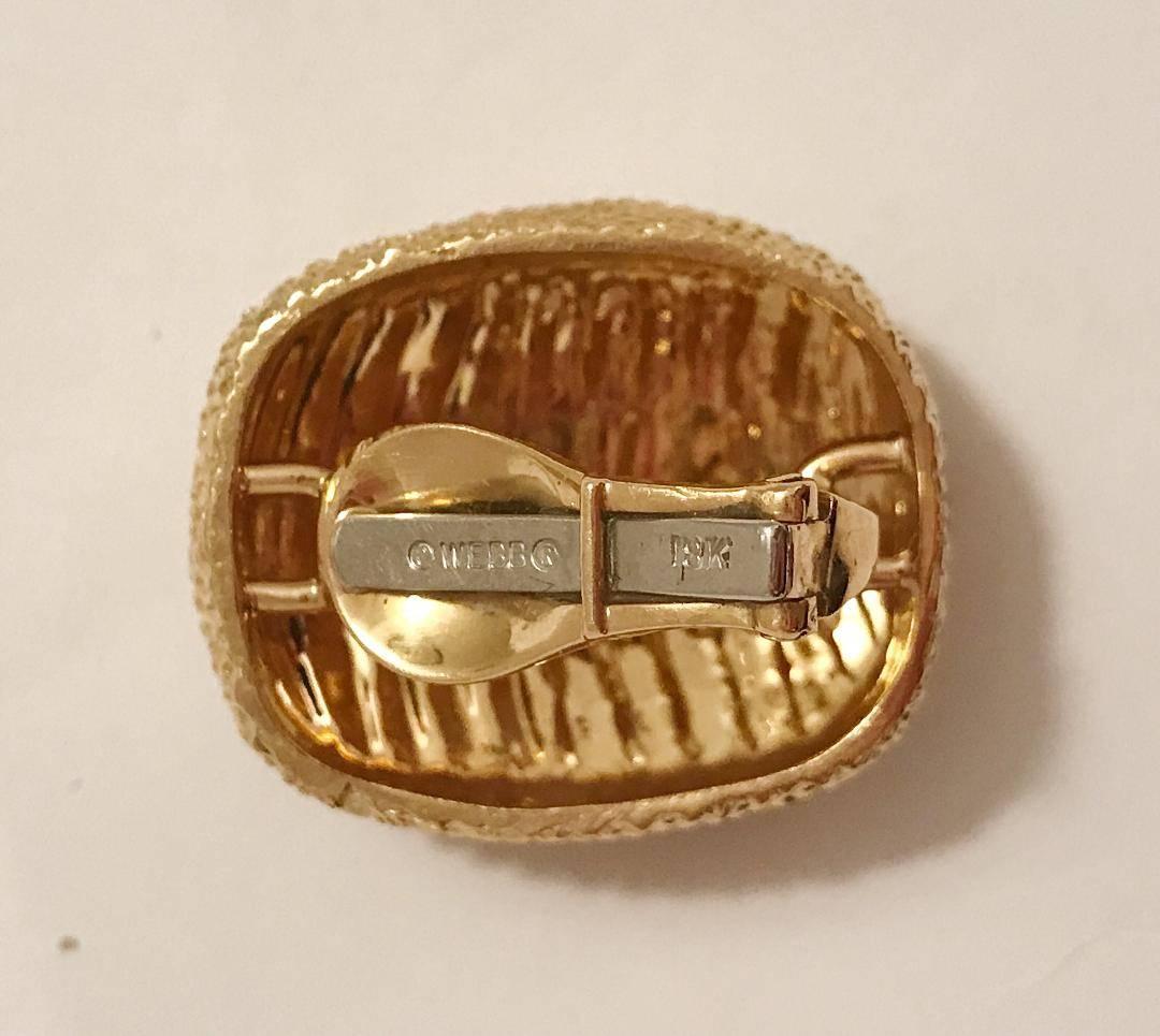 18kt Yellow Gold David Webb Stud Earring is stamped. 

This earring is clip on with an omega back.

Please let me know with any questions you may have.

Best,
Christina
