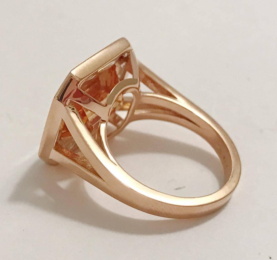 18kt Rose Gold Split Shank Ring with Imperal Topaz and surrounding rock crystal baguettes is a gorgeous statement piece.

This ring can be made in any stone combination and any color gold.

Please let me know if you have any