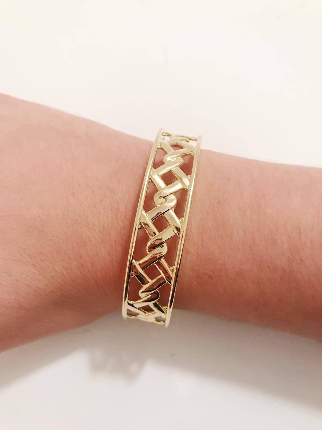 18kt Yellow Gold Mini Ordaned Cuff Bracelet. 

This bracelet can be made to any size wrist and any color gold.

Please let me know if you have any questions.

Best,
Christina