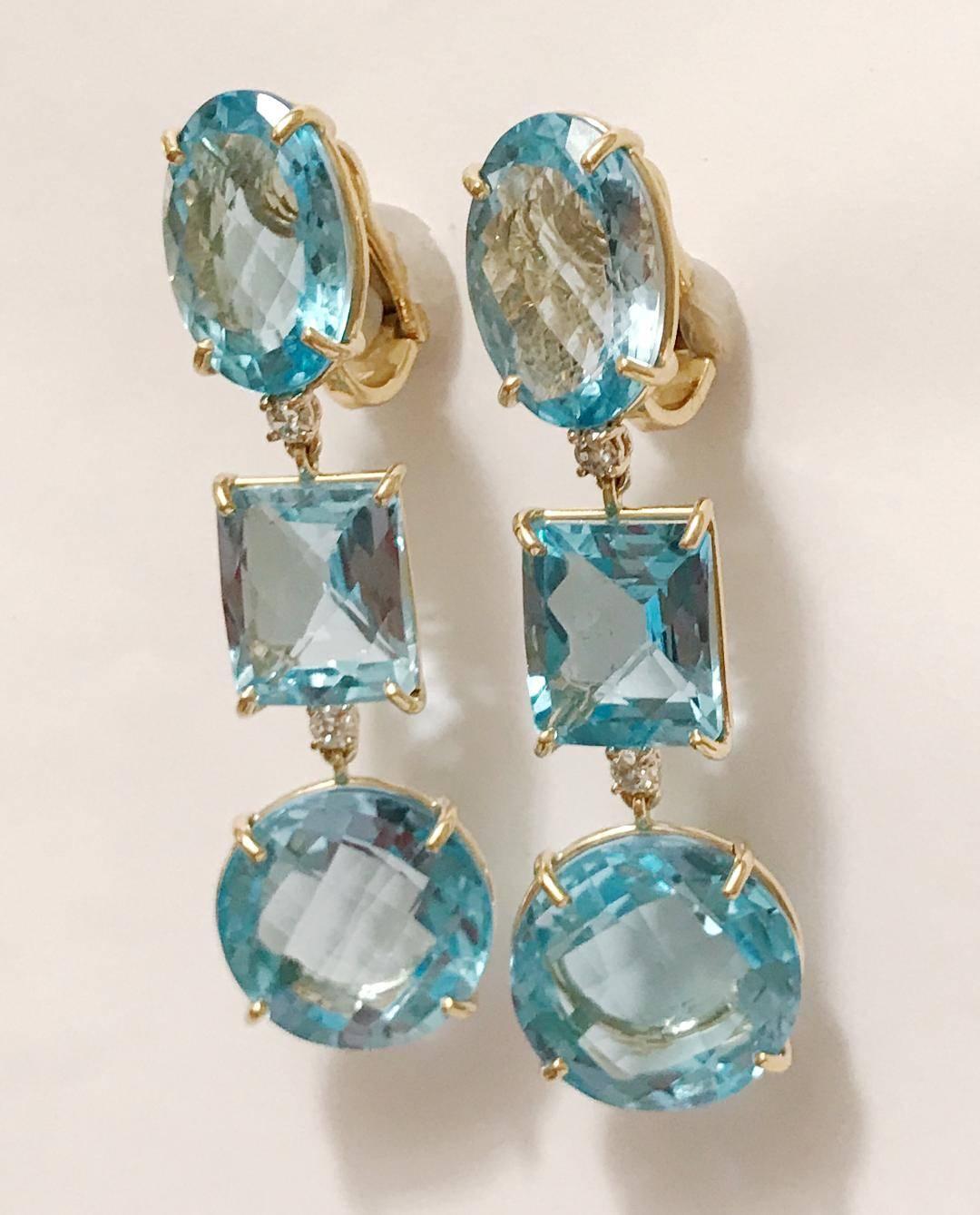 18kt Yellow Gold Three Drop Earring with Blue Topaz and Diamond

The top stone is oval, the middle stone is rectangle, and the bottom stone is circle. 

This earring can be posted or clip on or be mad in any stone combination. 

Please let me know