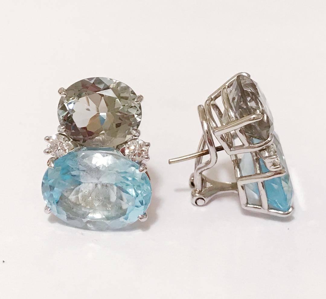 Large 18kt White Gold GUM DROP™ earrings with faceted Green Amethyst (approximately 5 cts each), faceted Pale Blue Topaz (approximately 12 cts each), and 4 diamonds weighing ~0.60 cts. 

The earrings measure 1