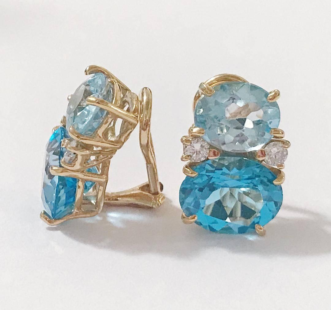 Medium 18kt yellow gold GUM DROP™ earrings with Two Toned faceted Blue Topaz (approximately 2.5 cts each), faceted Blue Topaz  (approximately 5 cts each), and 4 diamonds weighing ~0.40 cts. 

Specifications: Height: 3/4