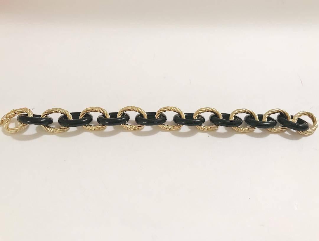 18kt Yellow Gold Bracelet with Alternating Black Jade links is an elegant statement piece.

This bracelet can be made with White Jade, Tigers Eye, or Ebony as a substitute to the Black jade In addition can be made with any color gold and measured to