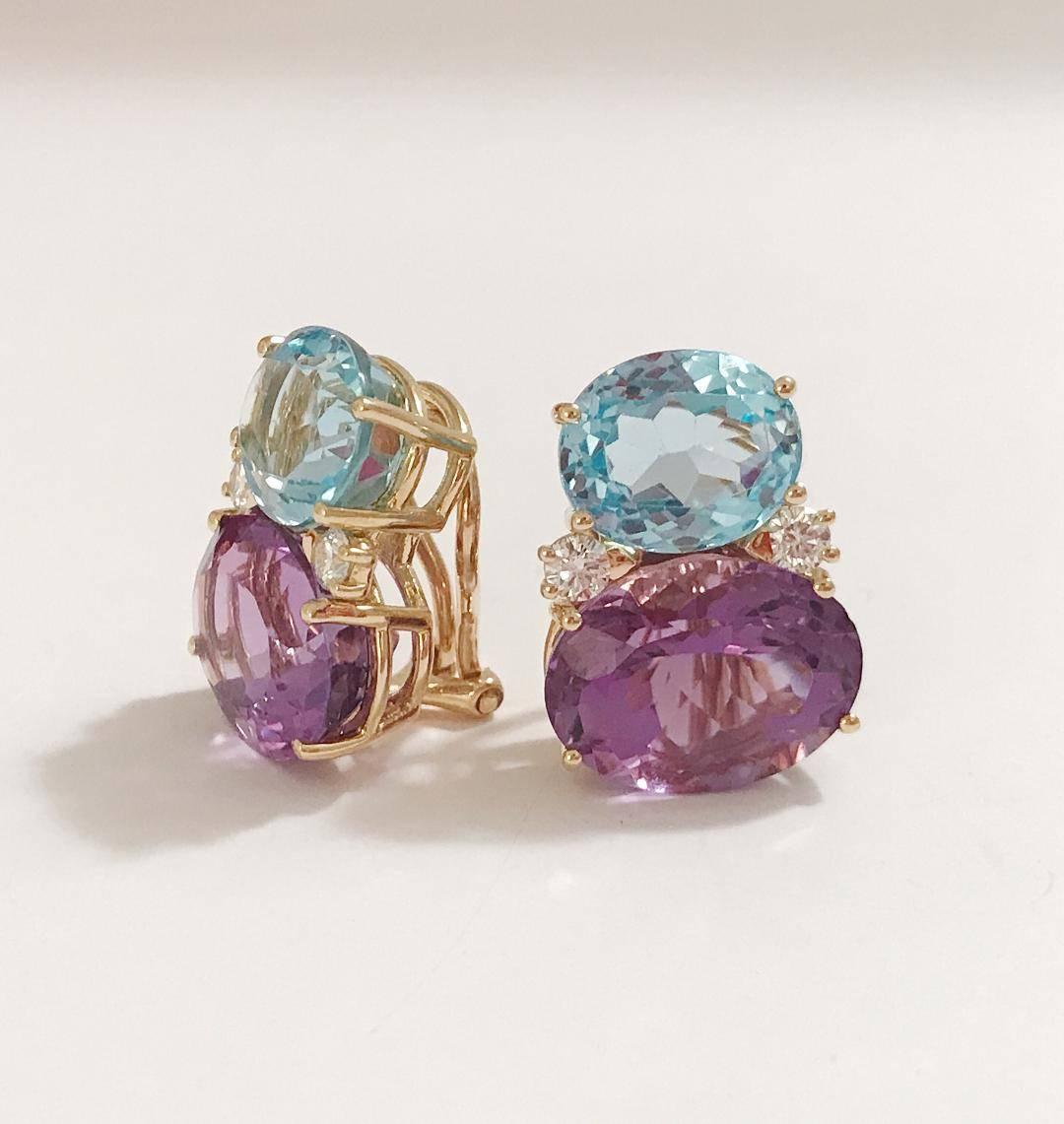 Large 18kt yellow gold GUM DROP™ earrings with Pale Blue Topaz (approximately 5 cts each), bright purple amethyst (approximately 12 cts each), and 4 diamonds weighing 0.60 cts.

The earrings measure 1