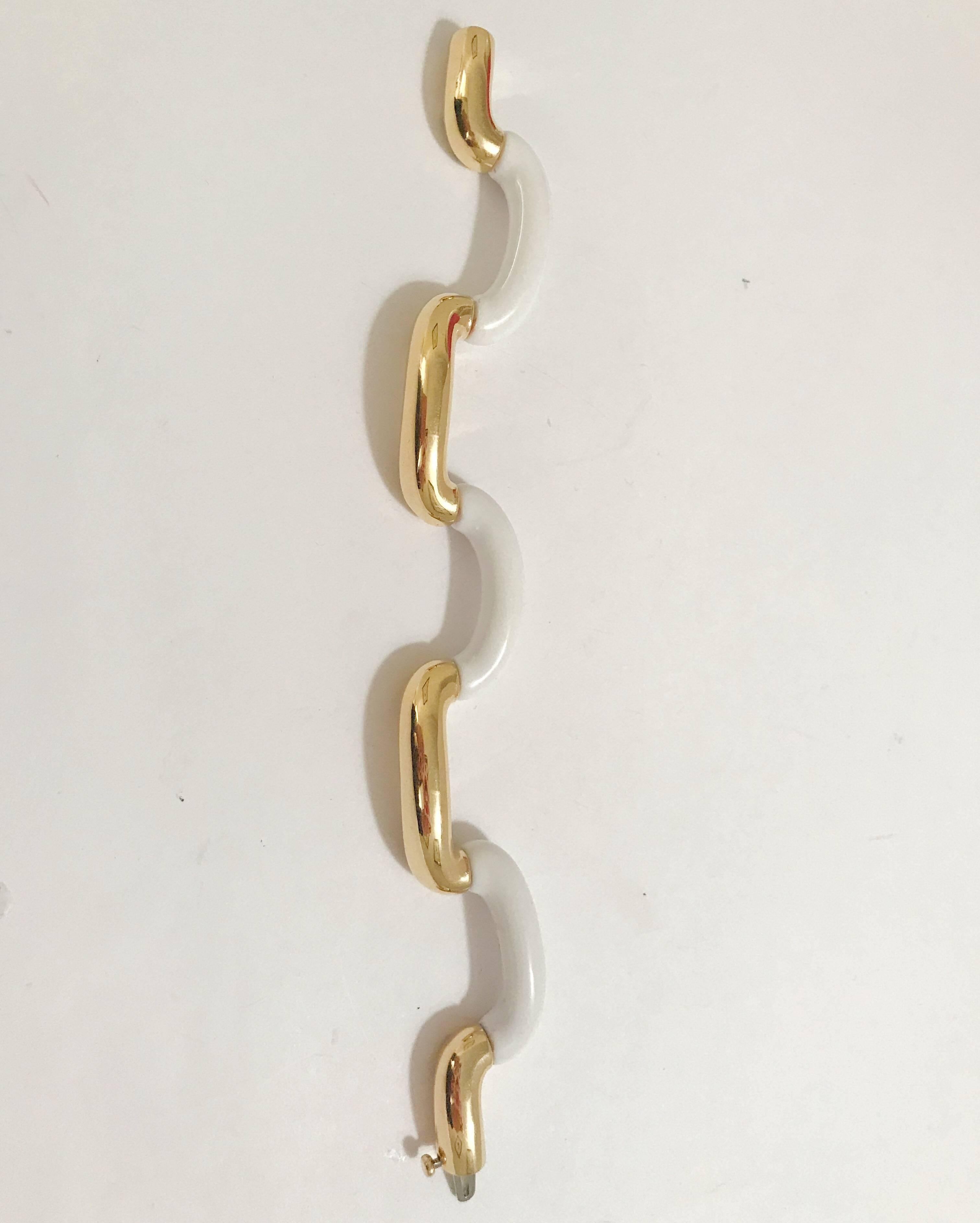 18kt Yellow Gold and White Jade Tubular Bracelet, is great statement piece.

This bracelet can be made to any size wrist and any color gold as well as any kind of stone to substitute the white jade (example: onyx or Amethyst).

Please let me know if