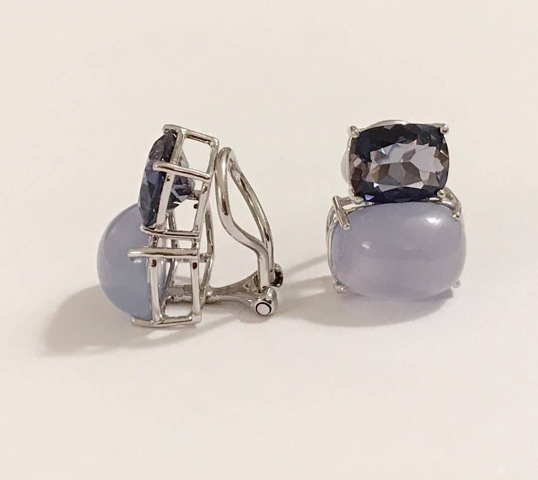Elegant 18kt White Gold Double Cushion Earrings with Faceted Iolite and Cabochon Chalcedony.

This is a classic day to evening earring that can be made clip or pierced. The meaning measures 3/4' tall and 1/2